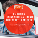 A male learner driver holding an L-plate.